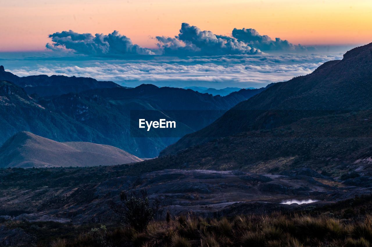 Scenic view of mountains against sky during sunset