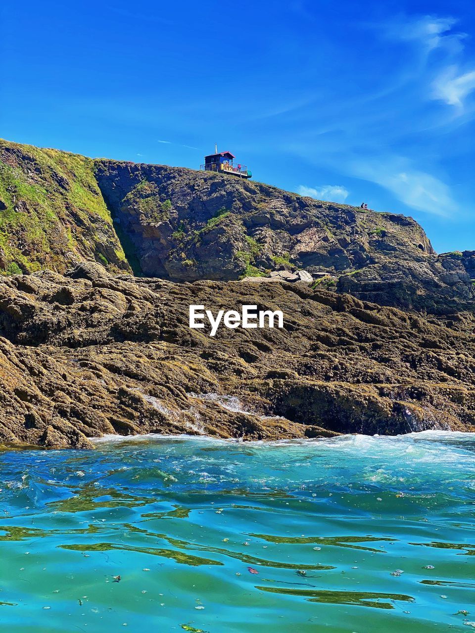 Scenic view of sea against blue sky