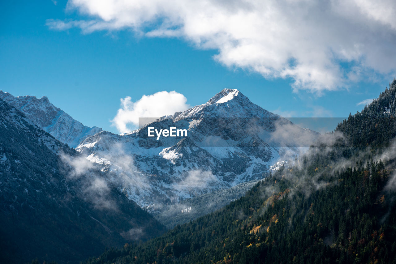 Scenic view of snowcapped mountains against sky