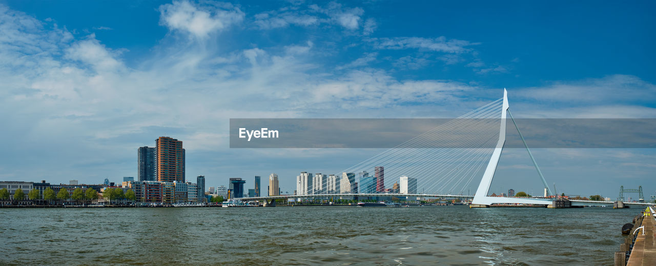 View of rotterdam over nieuwe maas with erasmusbrug bridge. rottherdam, the netherlands