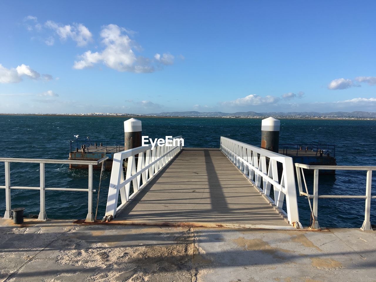 Pier over sea against sky