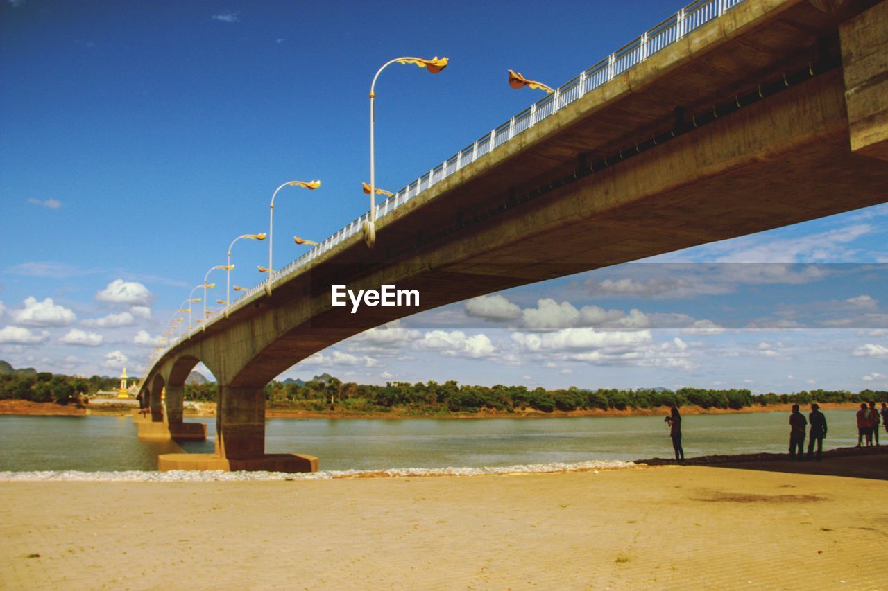 BRIDGE OVER CALM SEA AGAINST SKY