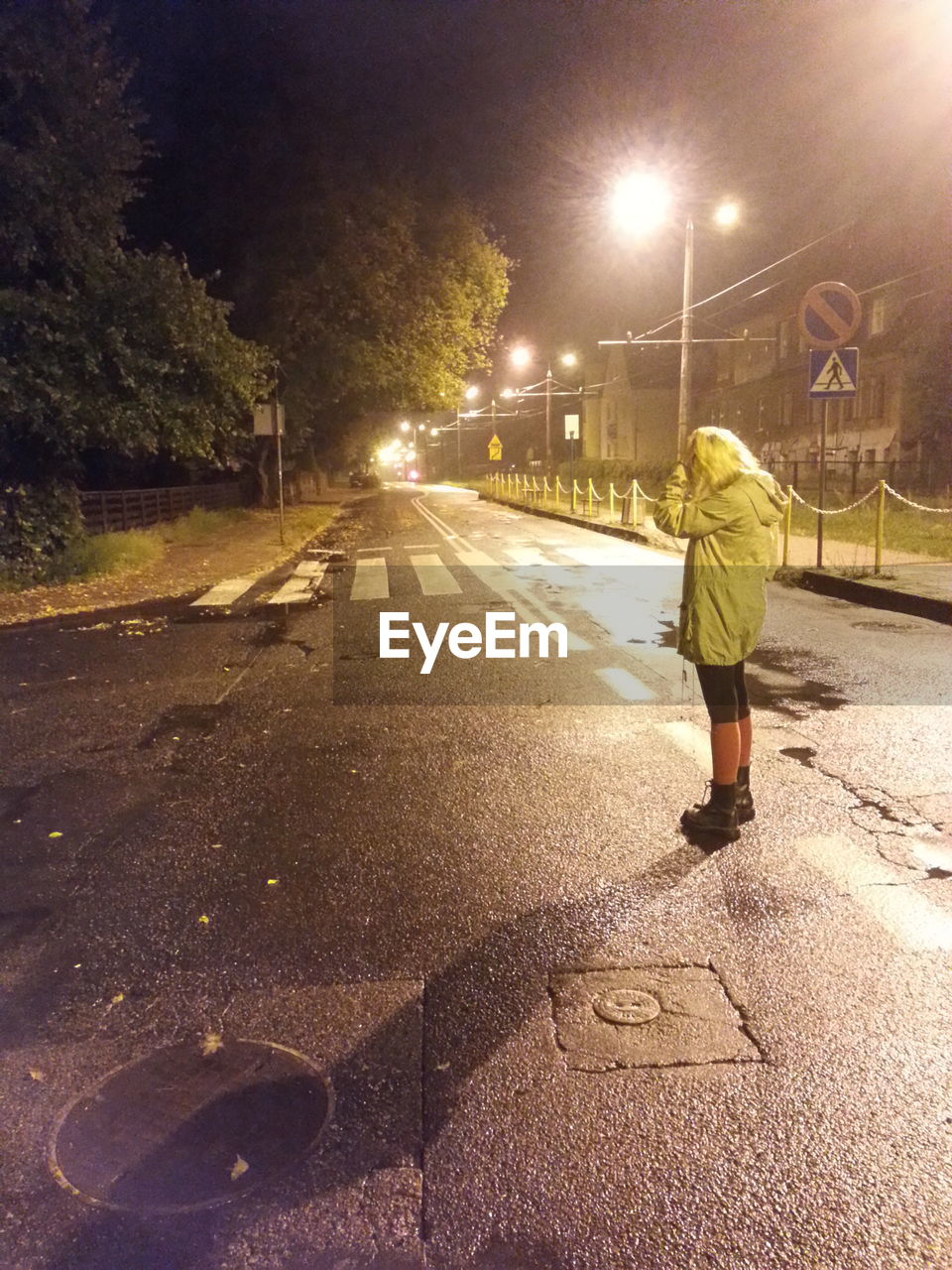 PEOPLE WALKING ON STREET AT NIGHT