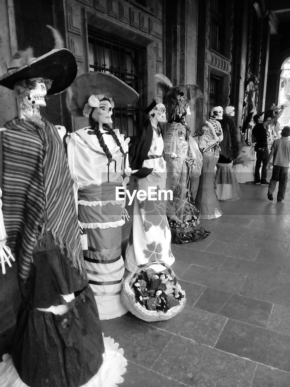 GROUP OF PEOPLE IN FRONT OF TRADITIONAL CLOTHING