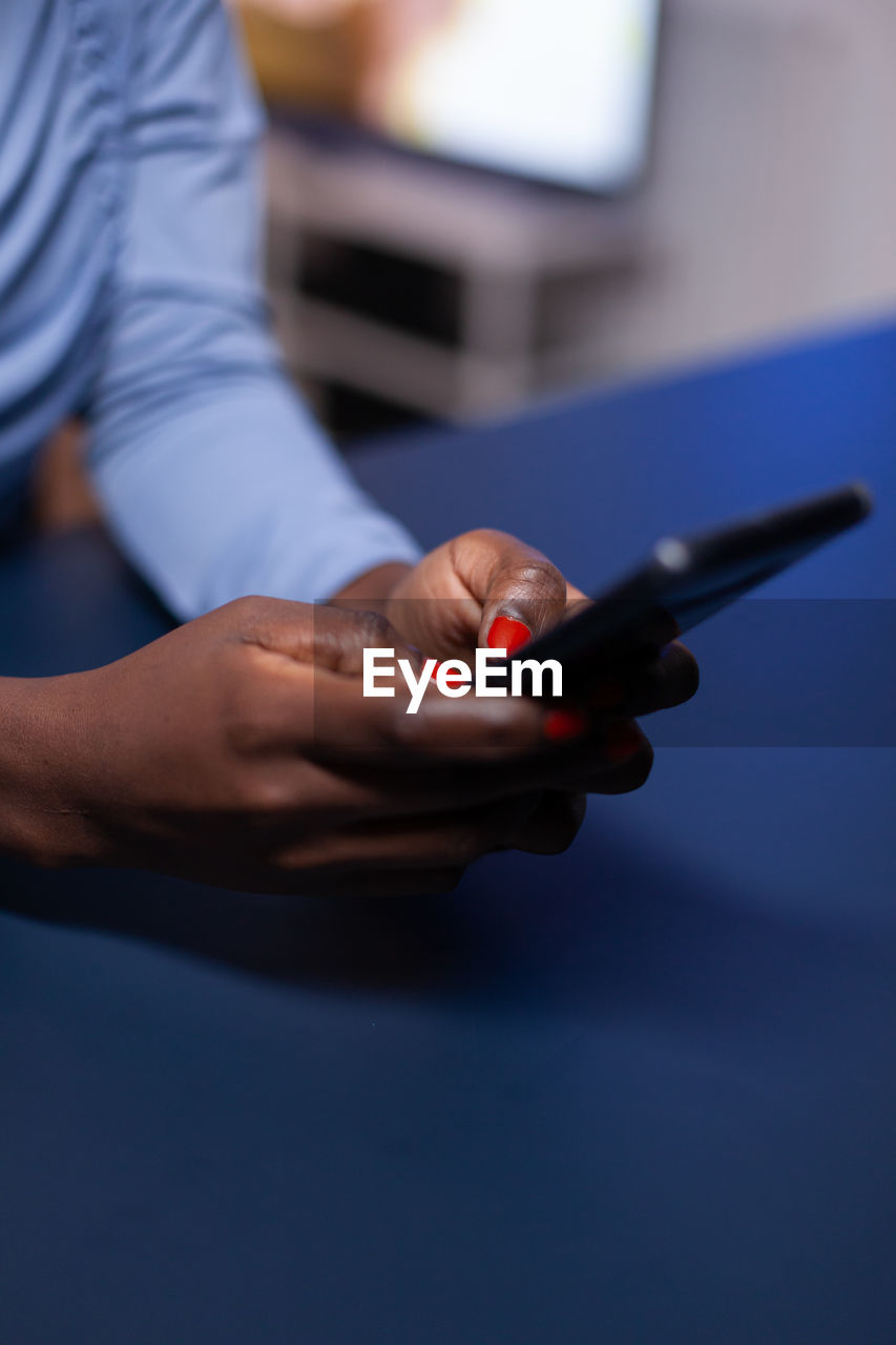 Close-up of man using mobile phone