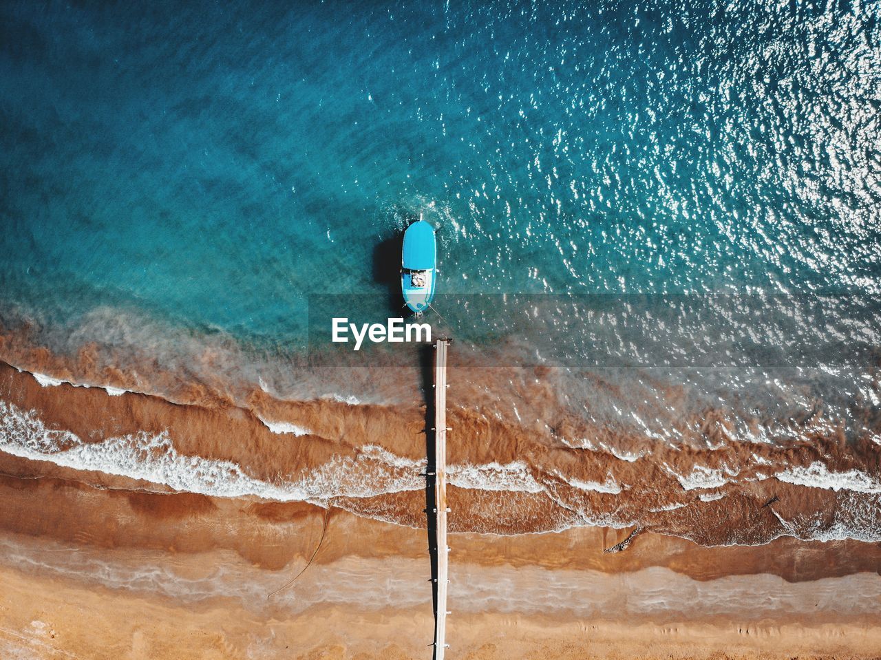 Aerial view of boat moored on sea