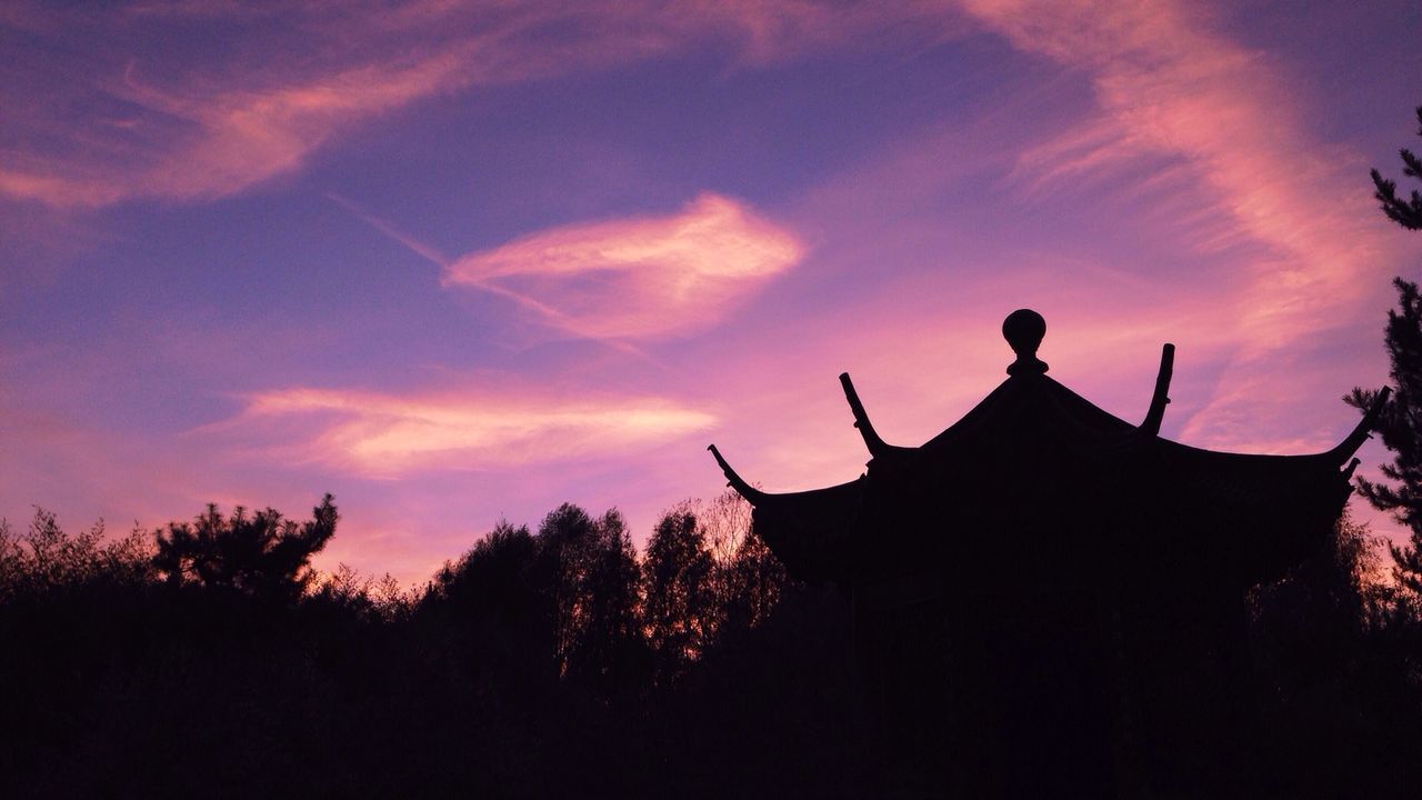 Low angle view of silhouette gazebo against sky at sunset