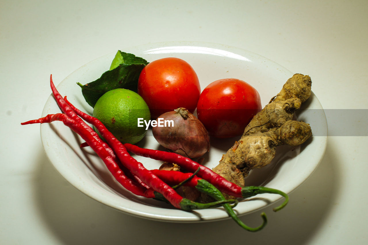 HIGH ANGLE VIEW OF FRUITS AND VEGETABLES ON TABLE