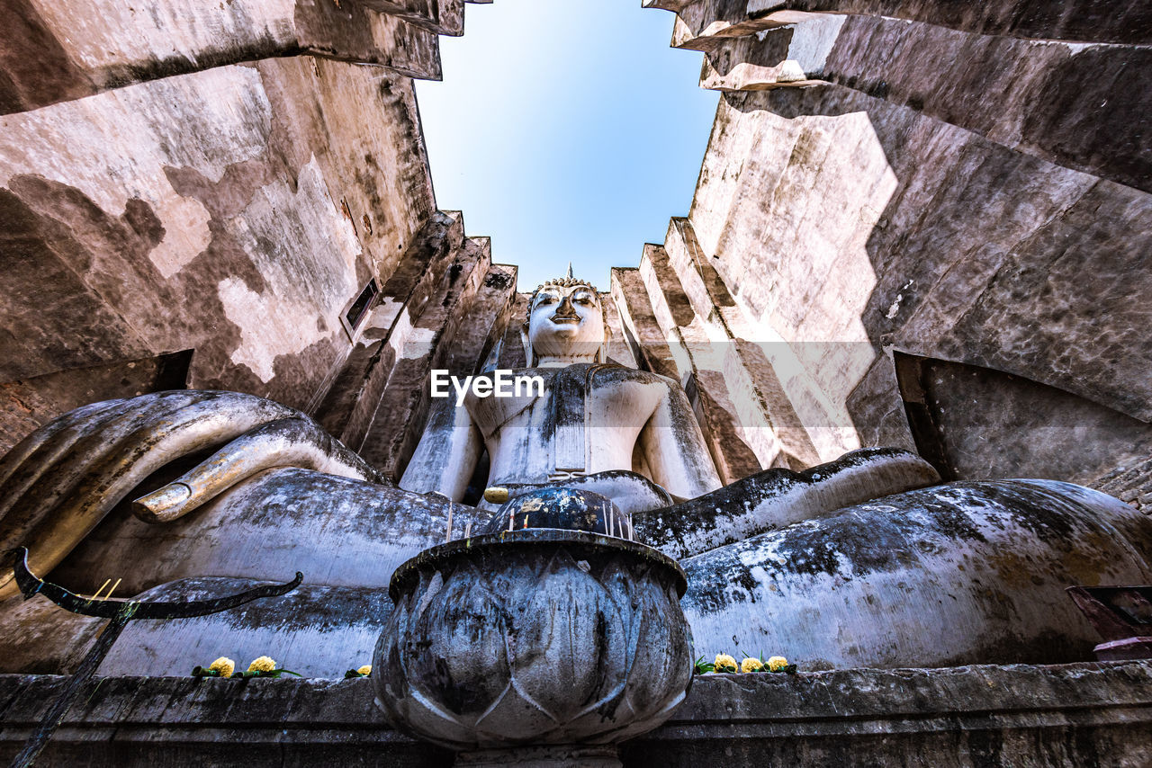 Low angle view of buddha statue