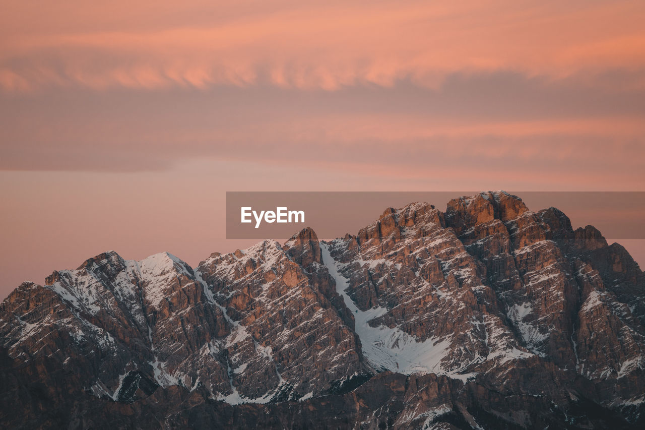 Rock formations against sky during sunset