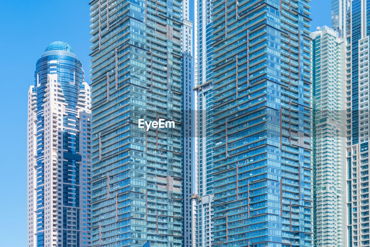 LOW ANGLE VIEW OF MODERN BUILDINGS IN CITY