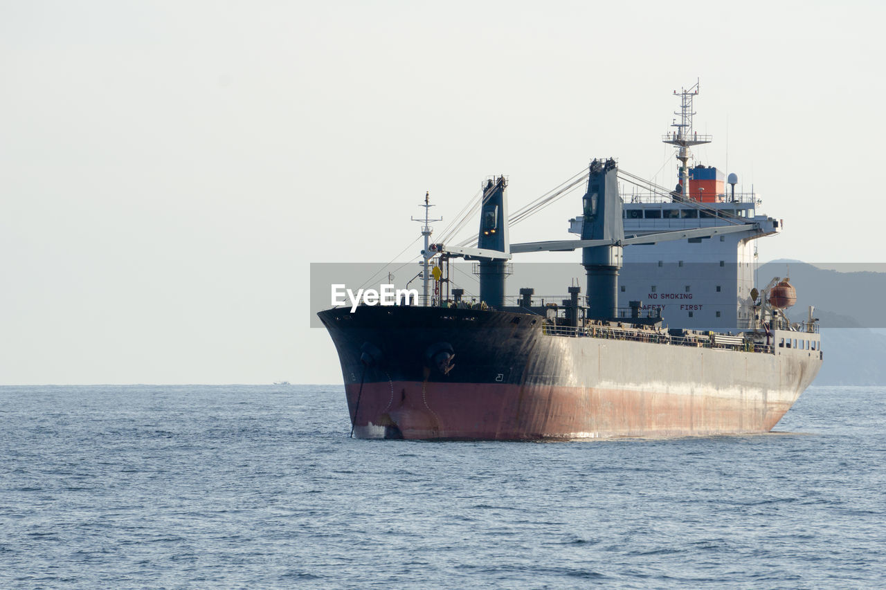 SHIP AT SEA AGAINST CLEAR SKY