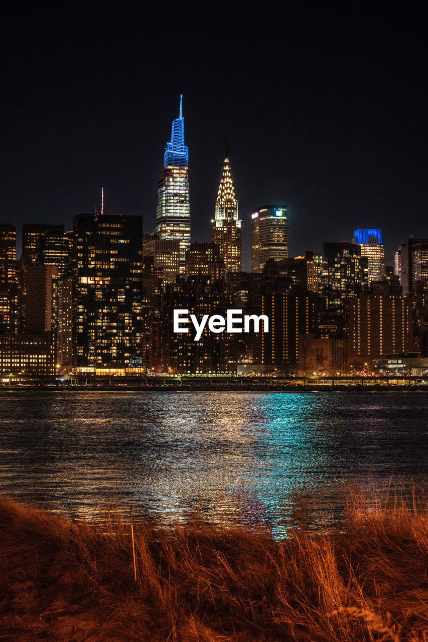 Illuminated buildings in city at night