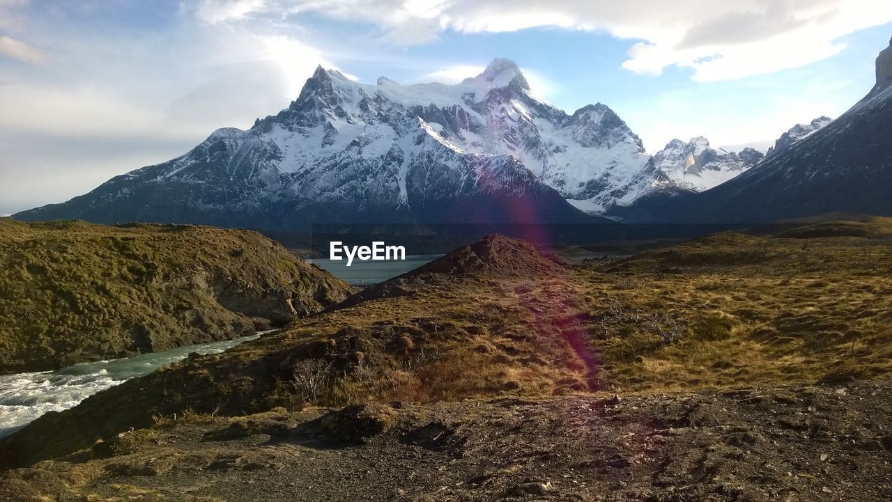 Scenic view of snowcapped mountains against sky