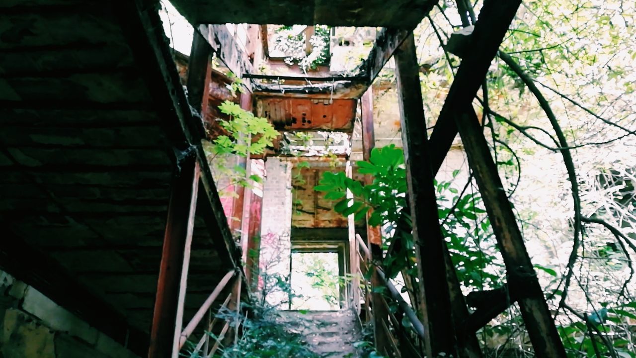 LOW ANGLE VIEW OF ABANDONED HOUSE