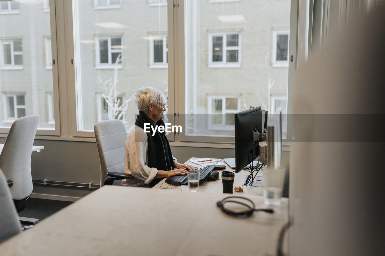 Woman sitting at desk in office