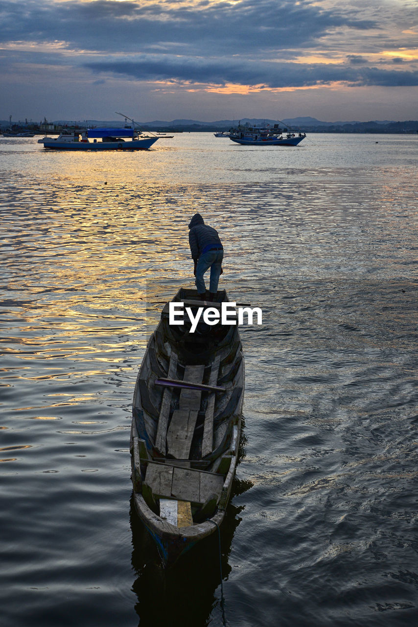 High angle view of wooden boat against cloudy sky