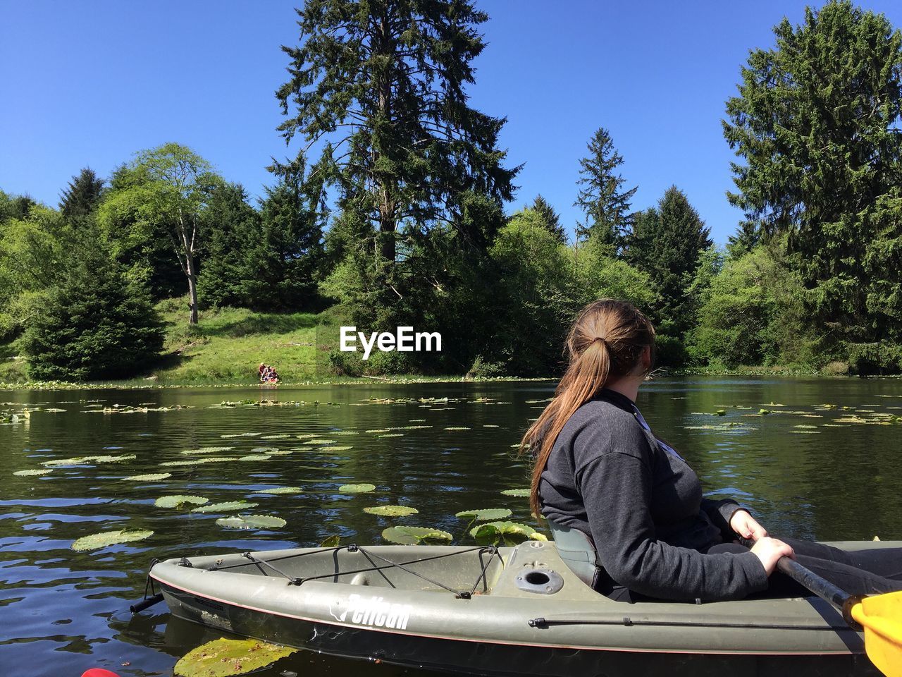 Woman kayaking in lake