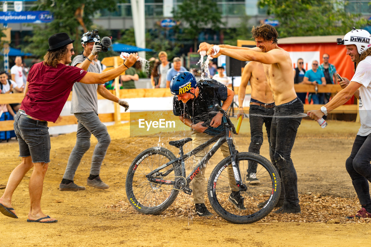 GROUP OF PEOPLE ON BICYCLES