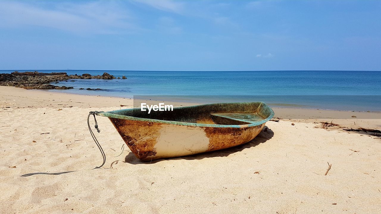 Scenic view of sea shore against sky