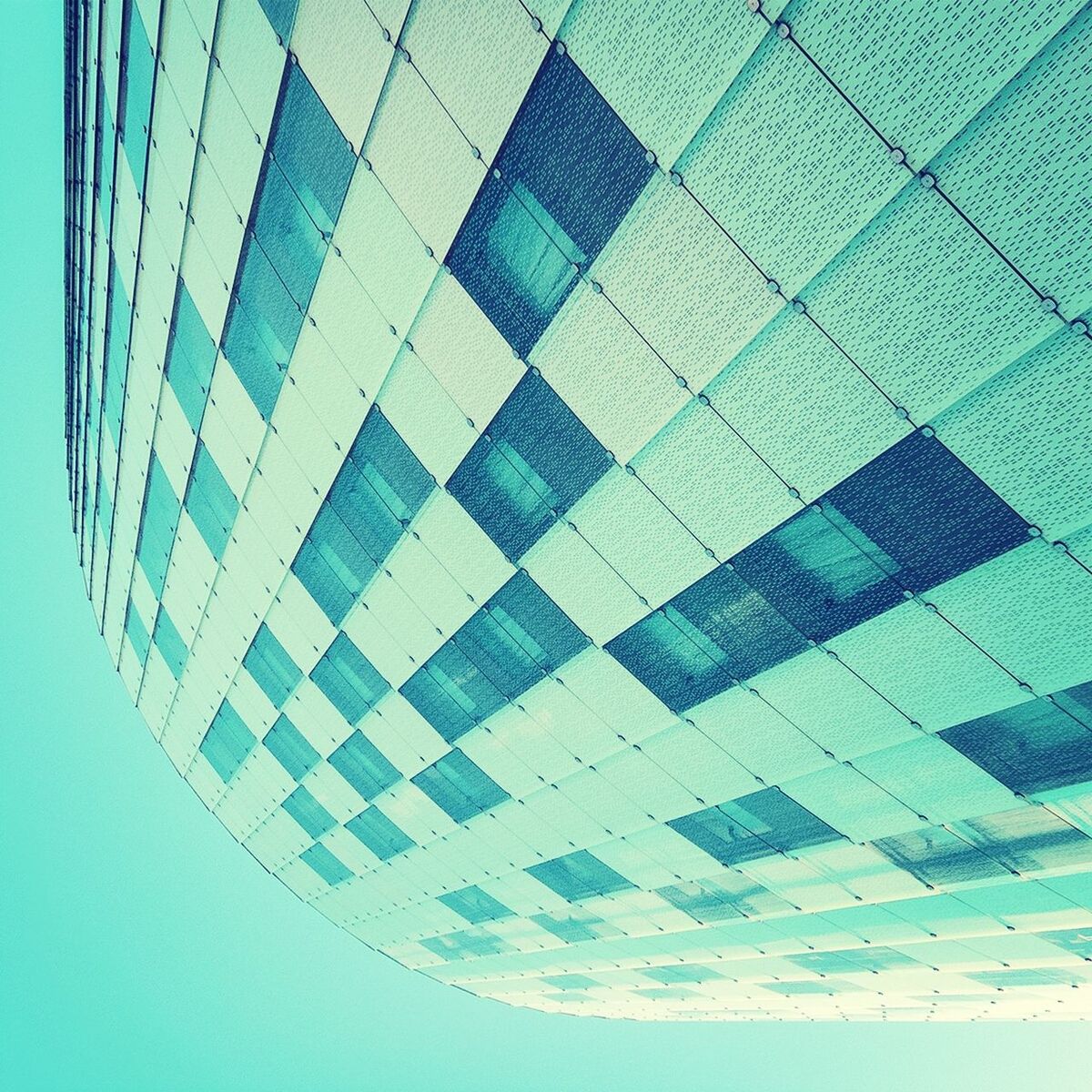 Low angle view of building against blue sky in city