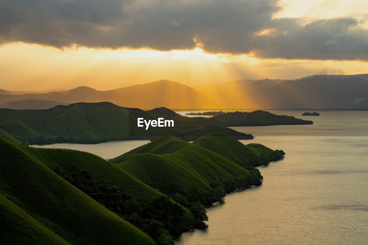 Sunlight shines from behind clouds