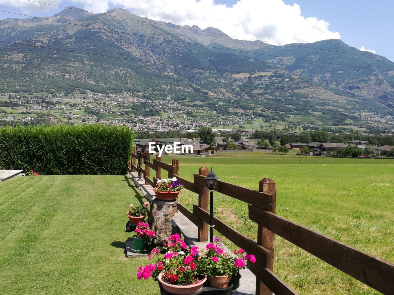 Scenic view of village against mountain at aosta valley