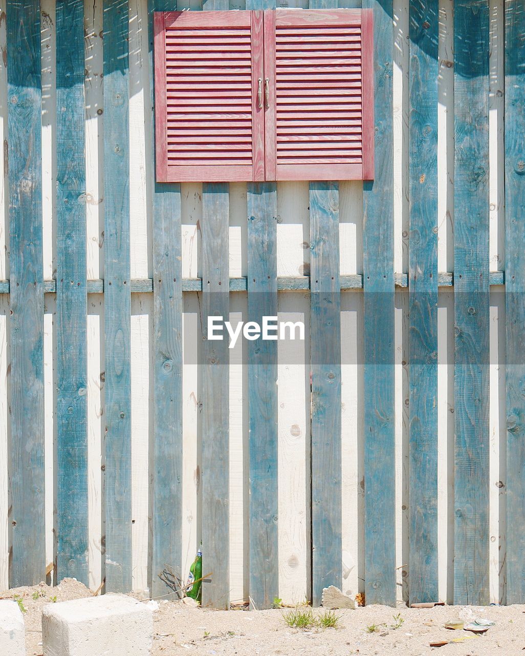 CLOSED WOODEN FENCE ON BUILDING