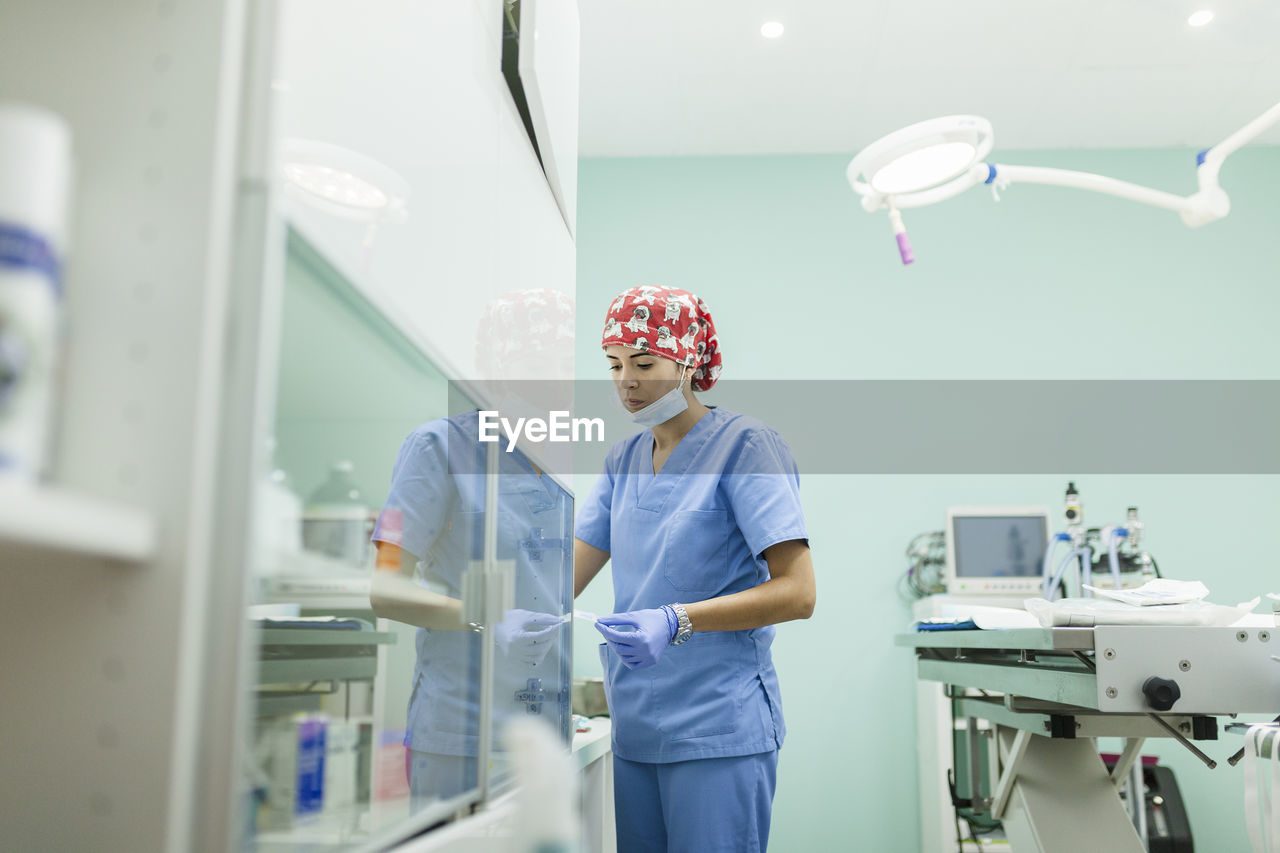 Young healthcare worker working at veterinary clinic