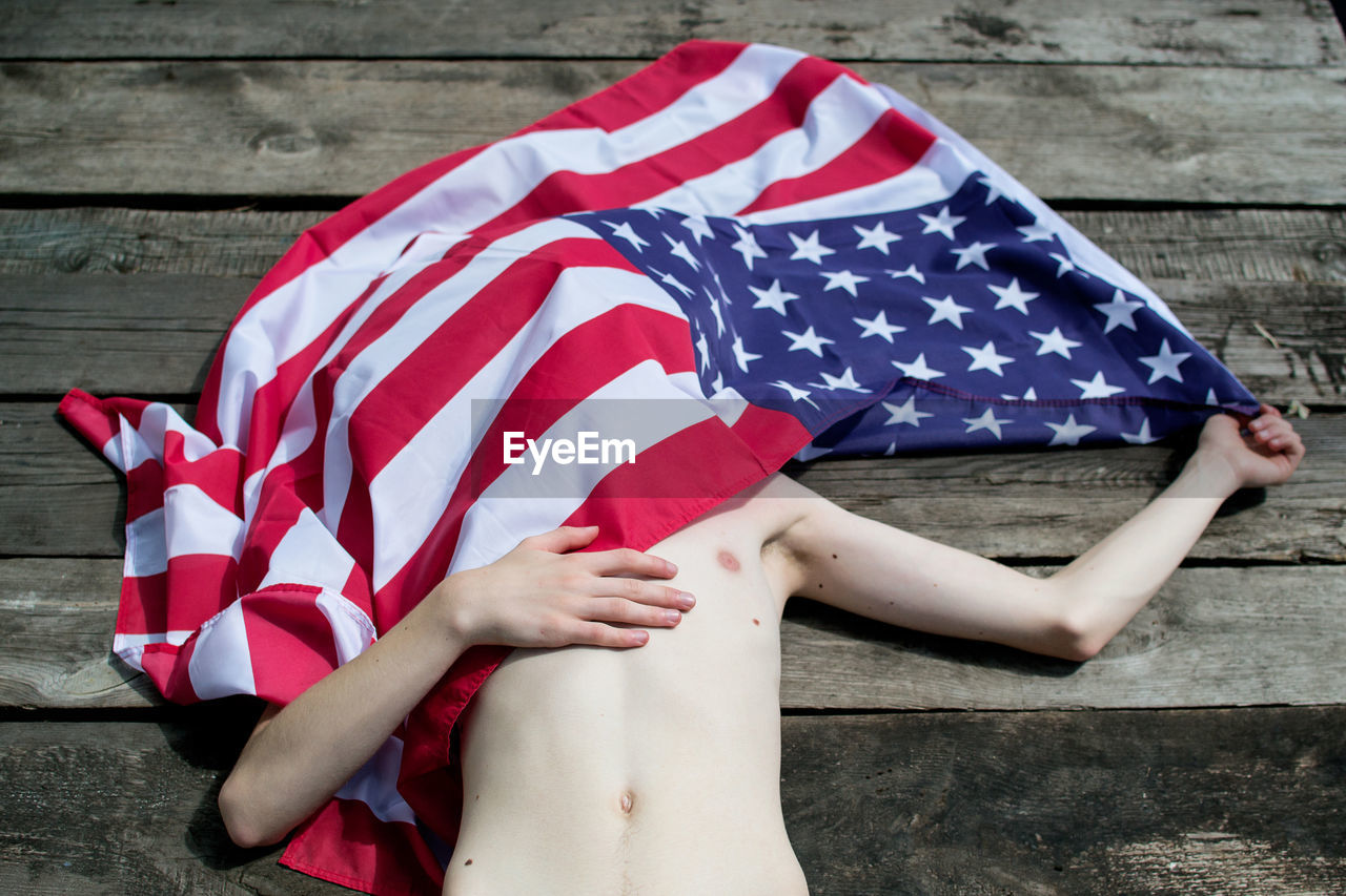Close-up of boy with american flag