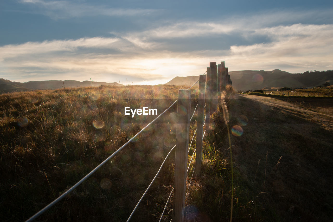 PANORAMIC SHOT OF RAILROAD TRACKS AGAINST SKY