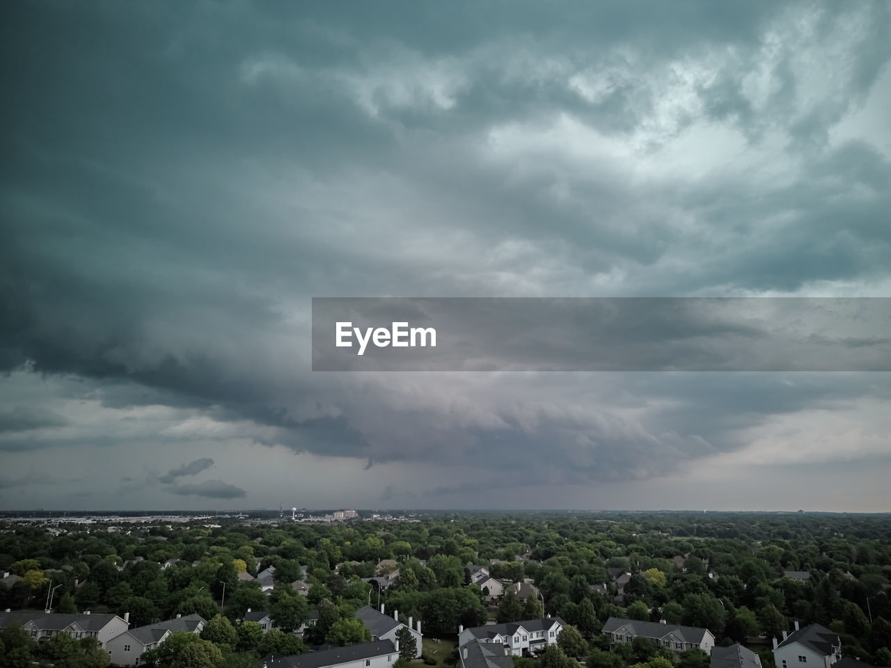 high angle view of townscape against cloudy sky