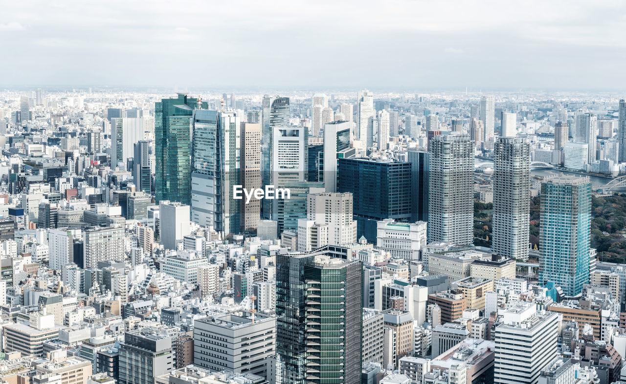 HIGH ANGLE VIEW OF MODERN BUILDINGS IN CITY