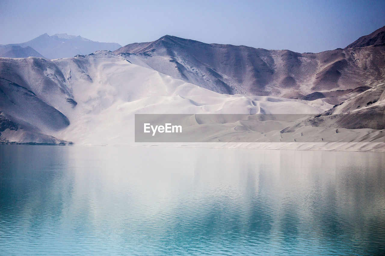 SCENIC VIEW OF MOUNTAINS AGAINST SKY DURING WINTER