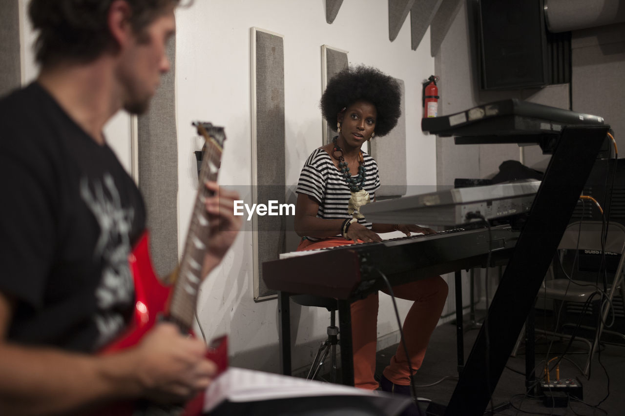 Musicians rehearsing in a recording studio