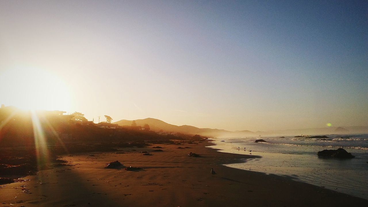 View of beach at sunset