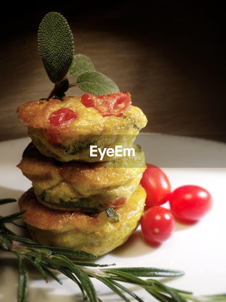 Close-up of frittata with cherry tomatoes served in plate