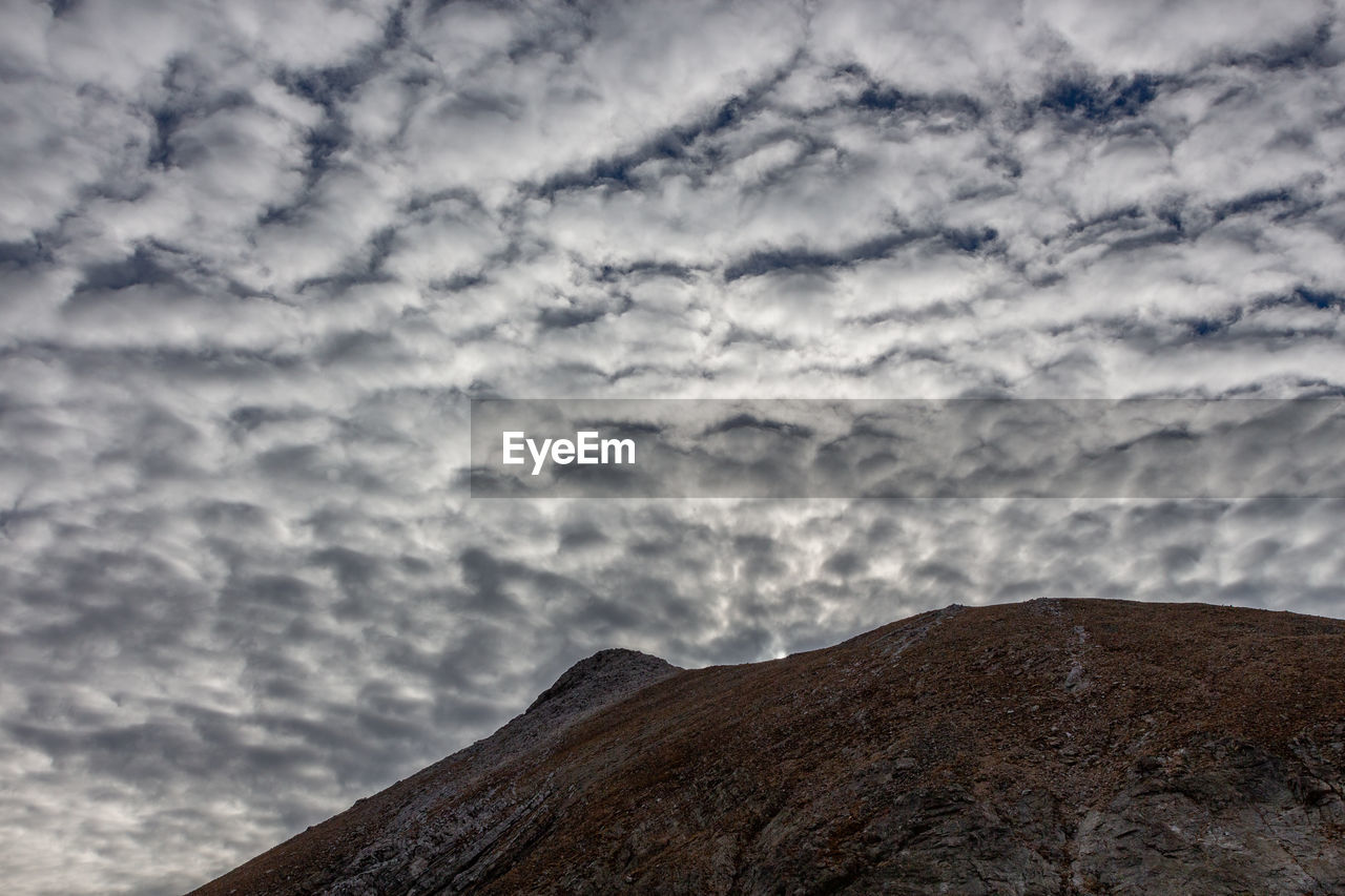 sky, cloud, mountain, beauty in nature, scenics - nature, horizon, environment, nature, no people, landscape, cloudscape, outdoors, dramatic sky, tranquility, non-urban scene, rock, day, tranquil scene, mountain range, land, overcast, sea