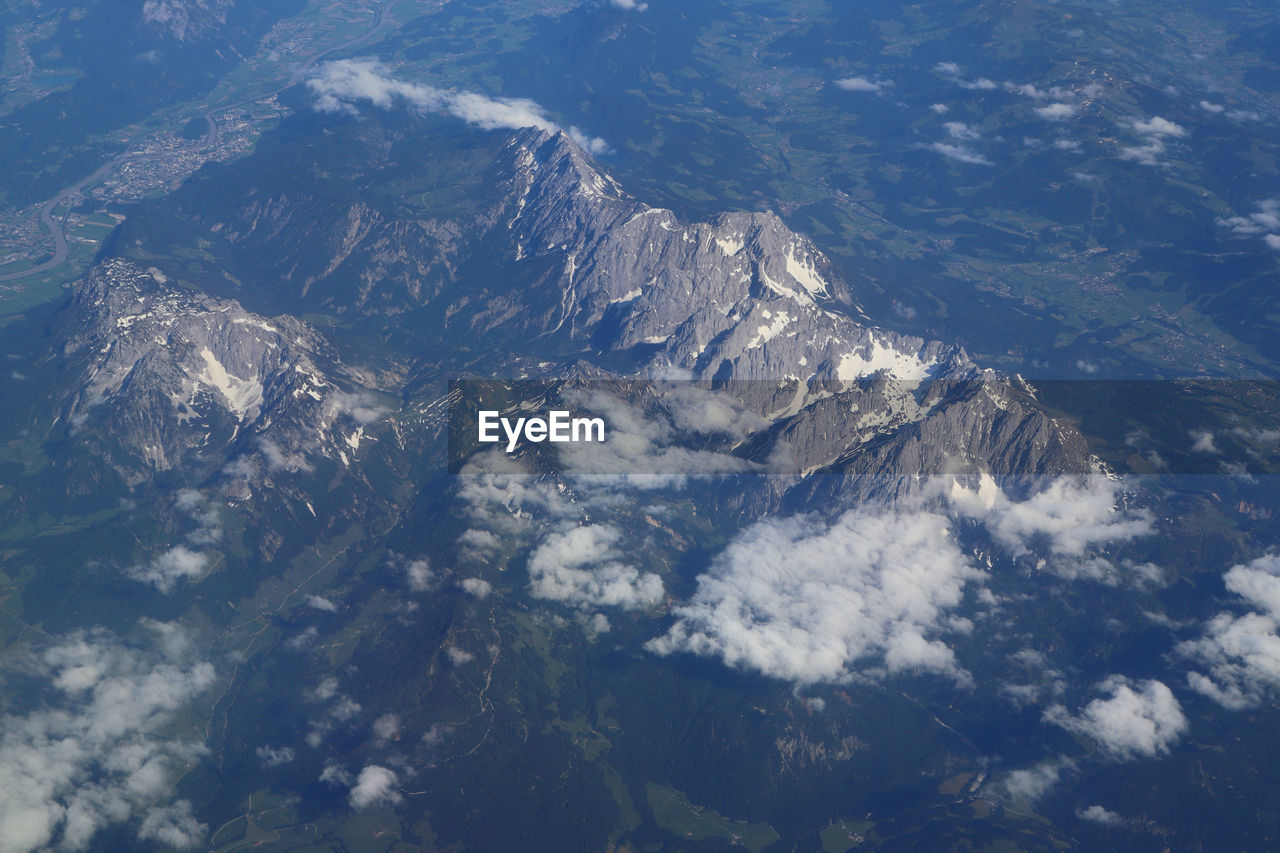 AERIAL VIEW OF SNOWCAPPED MOUNTAIN