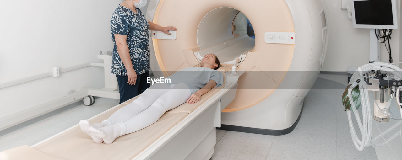 High angle view of woman standing in bathroom