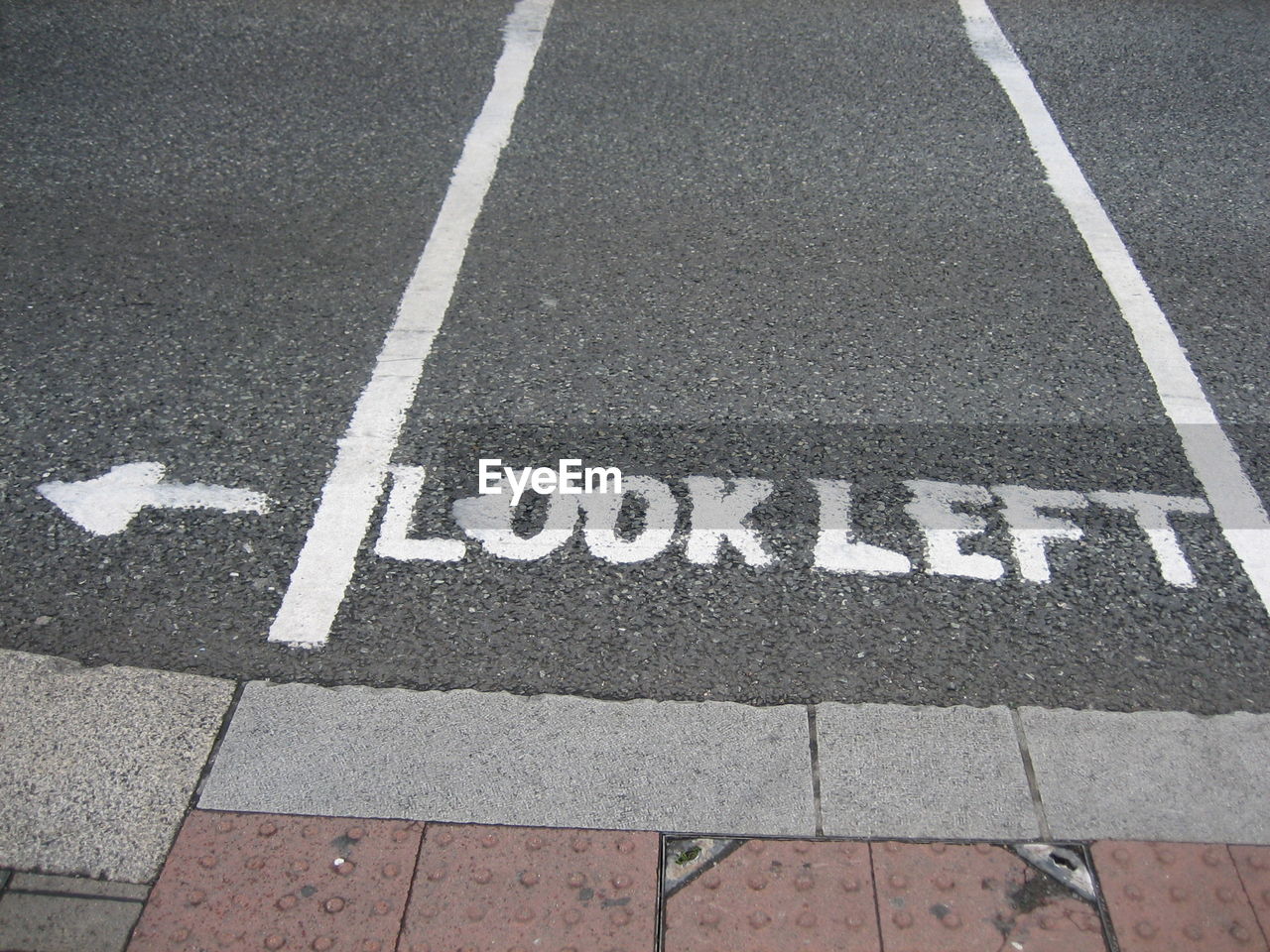 HIGH ANGLE VIEW OF ROAD MARKING ON THE GROUND