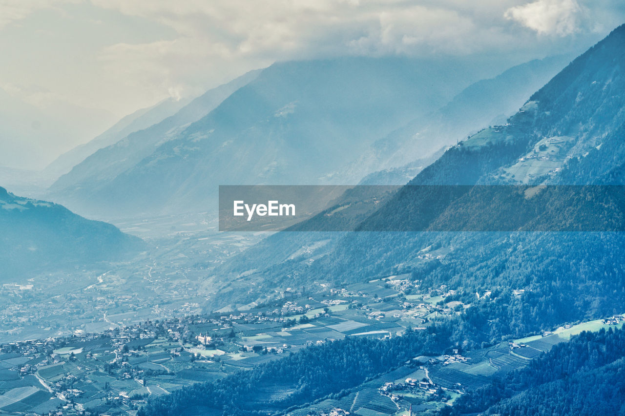 Aerial view of snowcapped mountains against sky