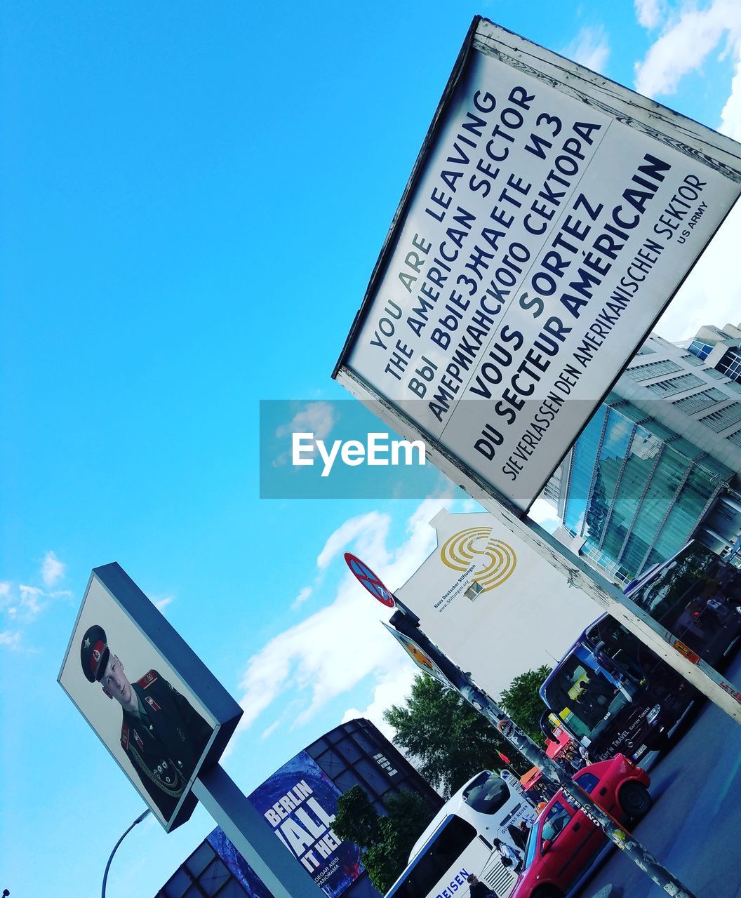 LOW ANGLE VIEW OF INFORMATION SIGN ON ROAD AGAINST SKY