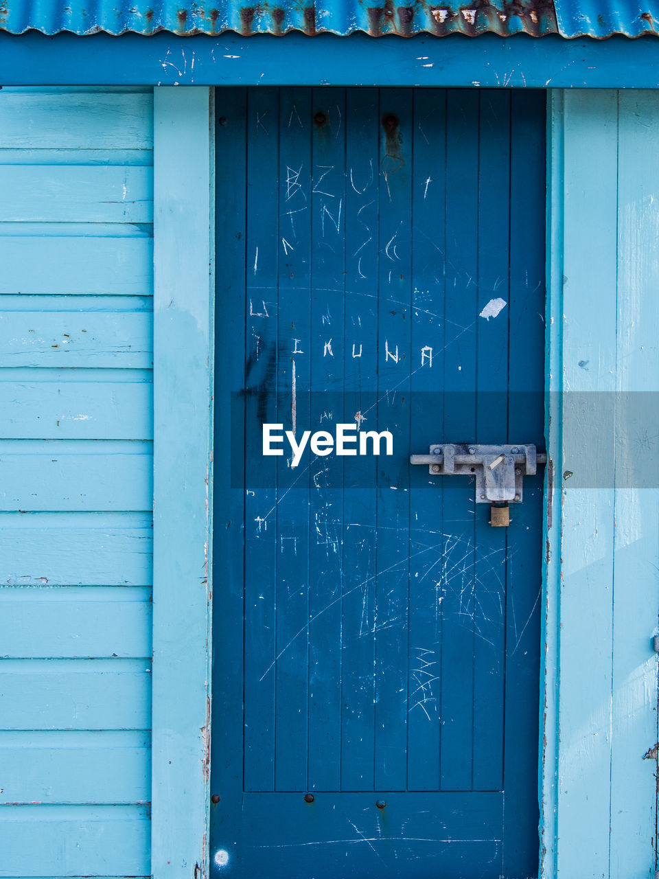 Scratched blue door