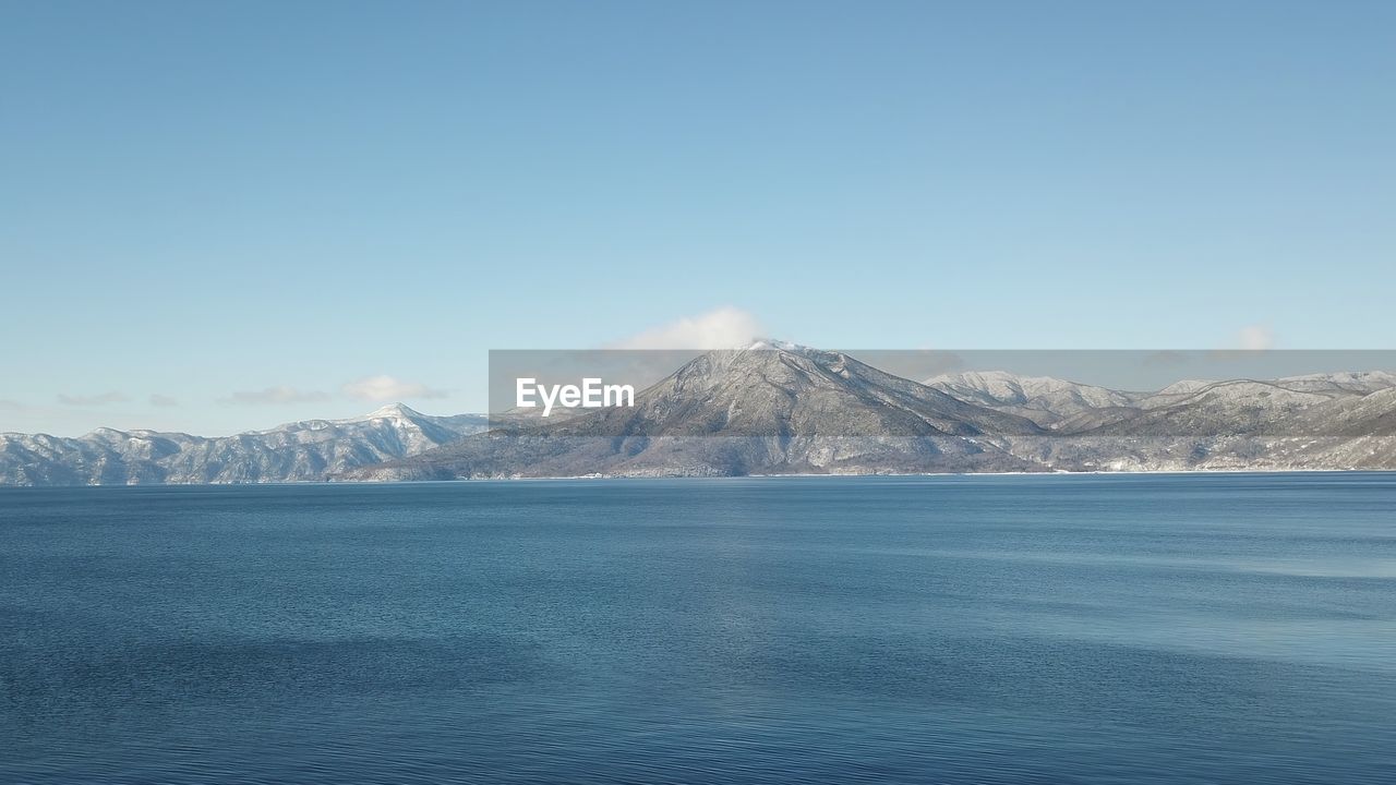 SCENIC VIEW OF SNOWCAPPED MOUNTAIN AGAINST SKY