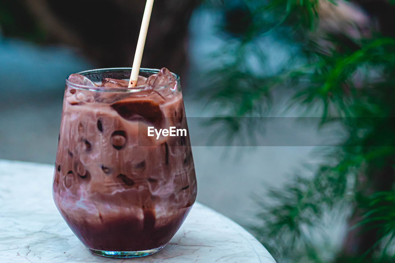 Close-up of iced chocolate drink on table