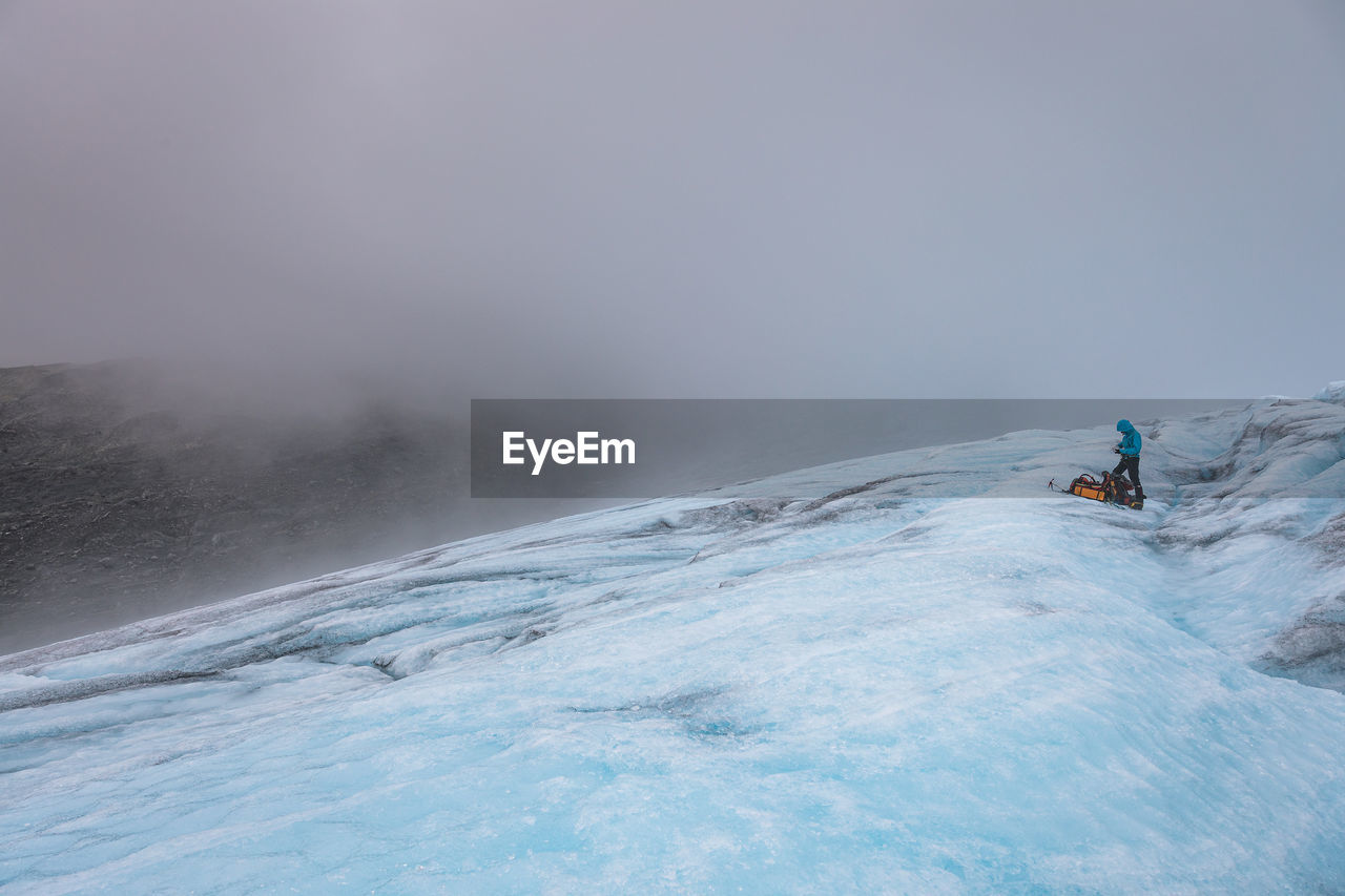 Full length of man on glacier