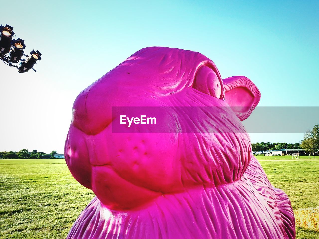 Close-up of pink rabbit sculpture in park