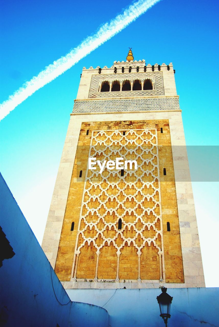 LOW ANGLE VIEW OF BUILT STRUCTURES AGAINST BLUE SKY