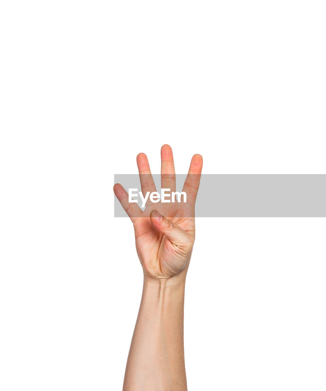 Cropped hand of person showing number 4 against white background